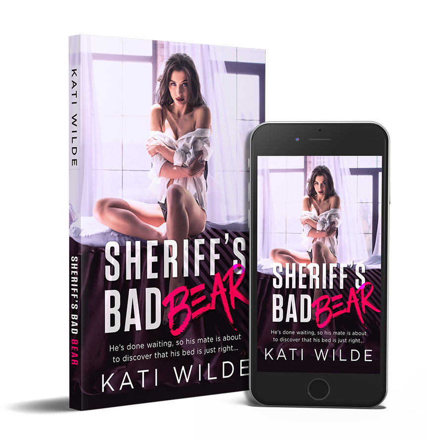 the cover for Sheriff's Bad Bear featuring a dark haired woman on a bed